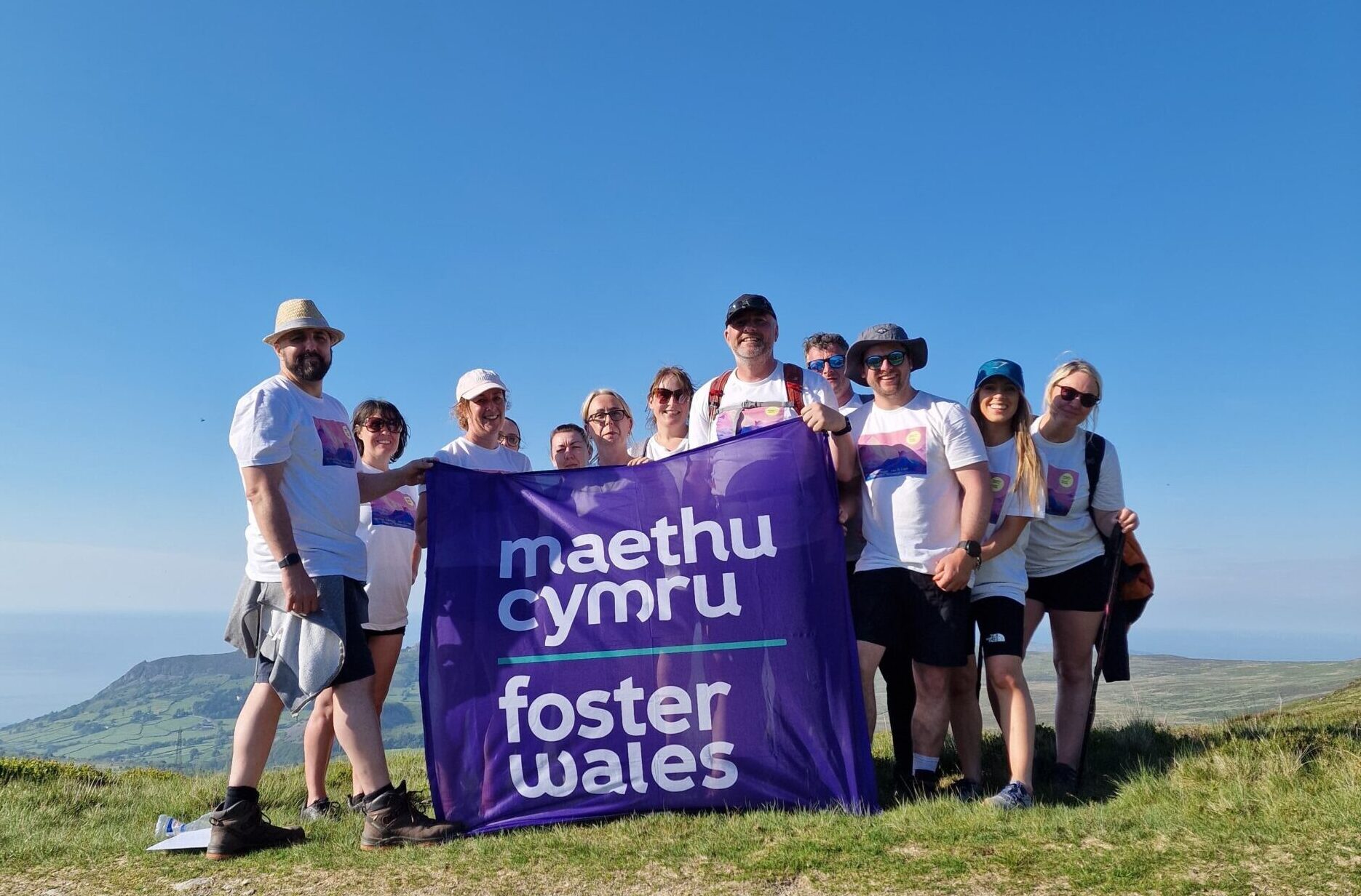 Group holding flag on Eryri